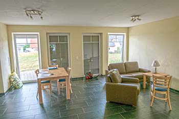 Photograph of door-like German windows set side-by-side to create a picture window effect.